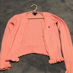 A pink Polo Ralph Lauren button up sweater